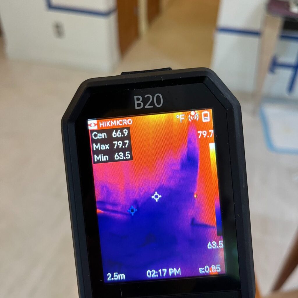 Thermal imaging camera detecting surface temperatures.