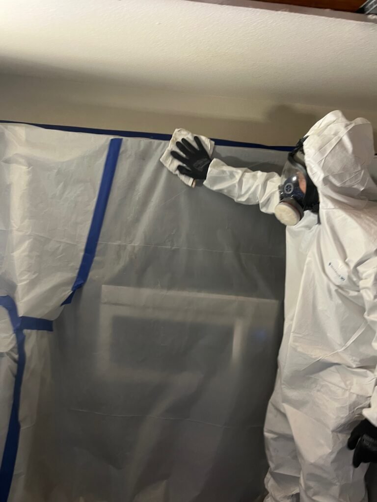 North Hollywood Damage Restoration Services | Onsite Pro 30 wiping surfaces in containment